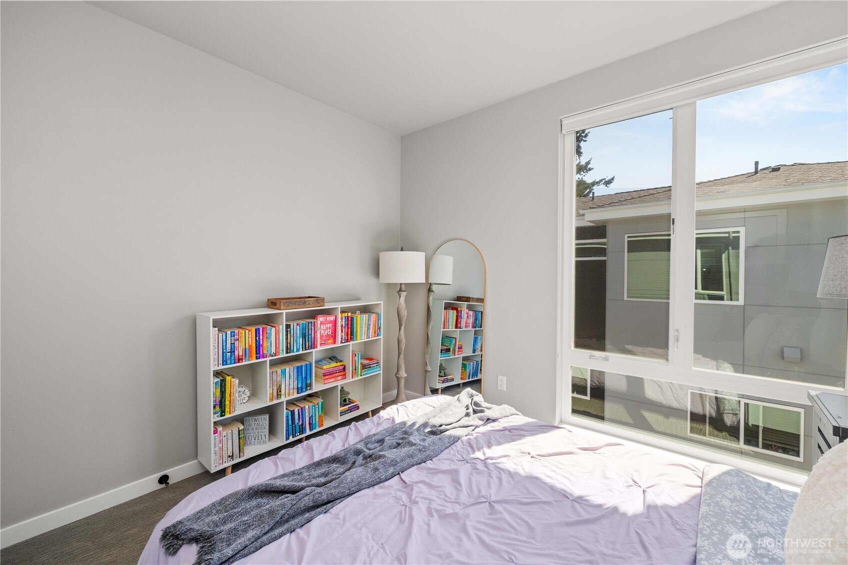 1208 Harrington Avenue Northeast Renton, WA 98056 - Photo 23 of 40 a bedroom with a bed and a large window