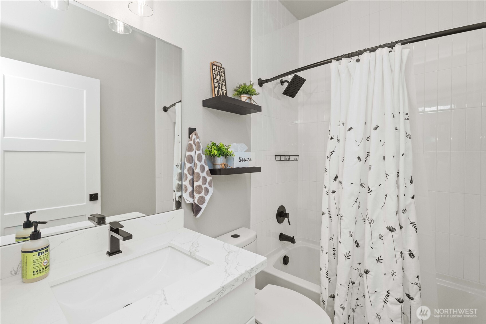 1208 Harrington Avenue Northeast Renton, WA 98056 - Photo 24 of 40 a bathroom with a sink toilet and shower