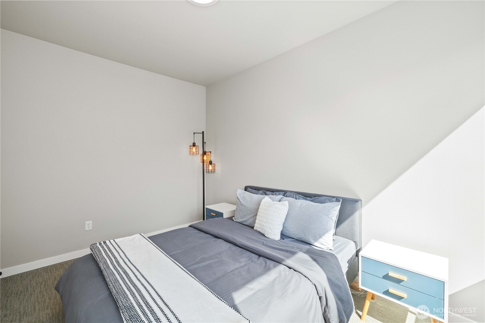 1208 Harrington Avenue Northeast Renton, WA 98056 - Photo 27 of 40 a bedroom with a bed and a night stand