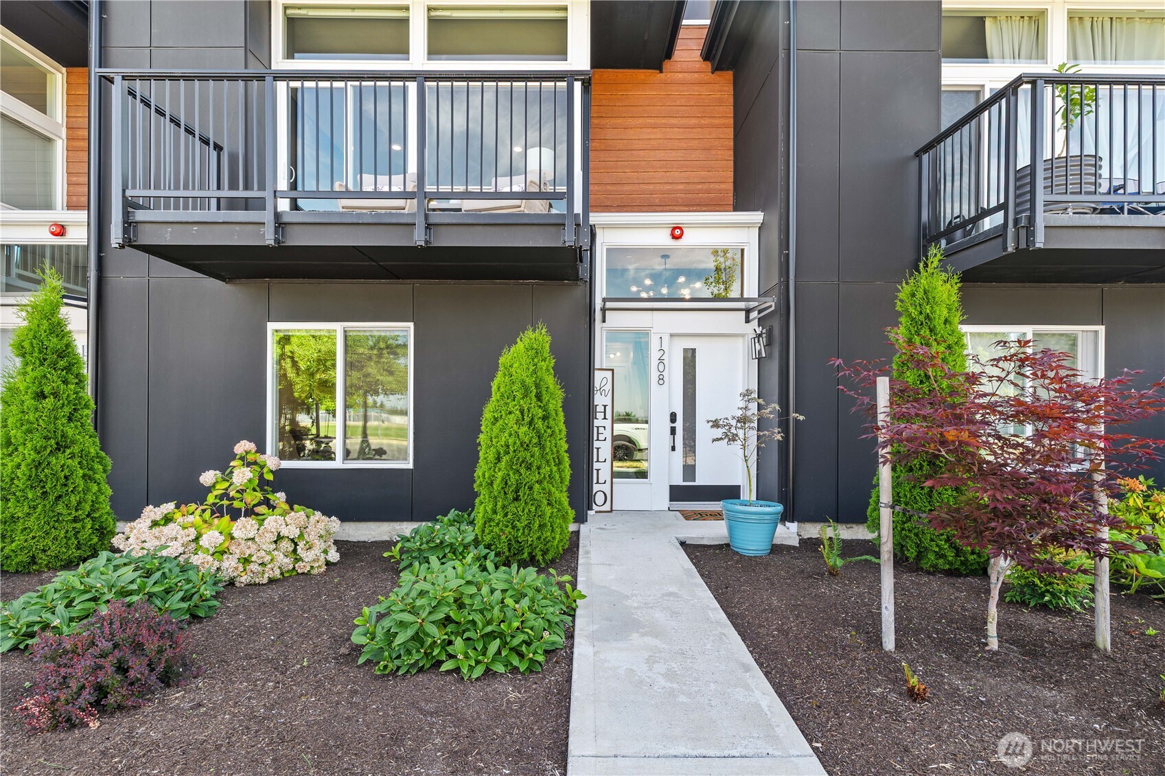 1208 Harrington Avenue Northeast Renton, WA 98056 - Photo 3 of 40 a front view of a house having yard