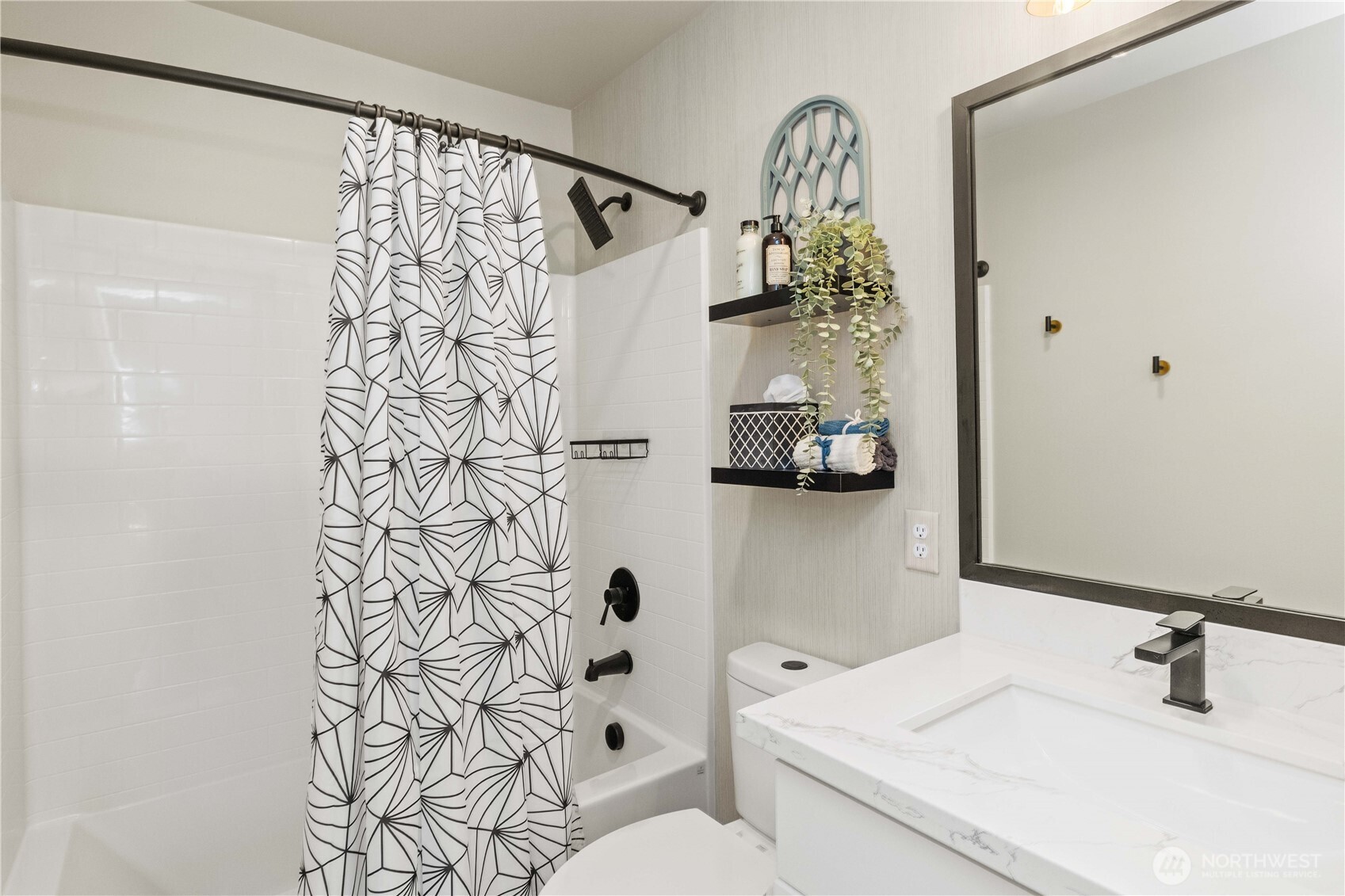 1208 Harrington Avenue Northeast Renton, WA 98056 - Photo 31 of 40 a bathroom with a sink and mirror with shower