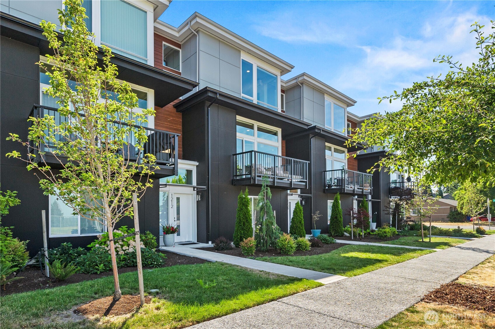 1208 Harrington Avenue Northeast Renton, WA 98056 - Photo 39 of 40 a front view of a house with a garden