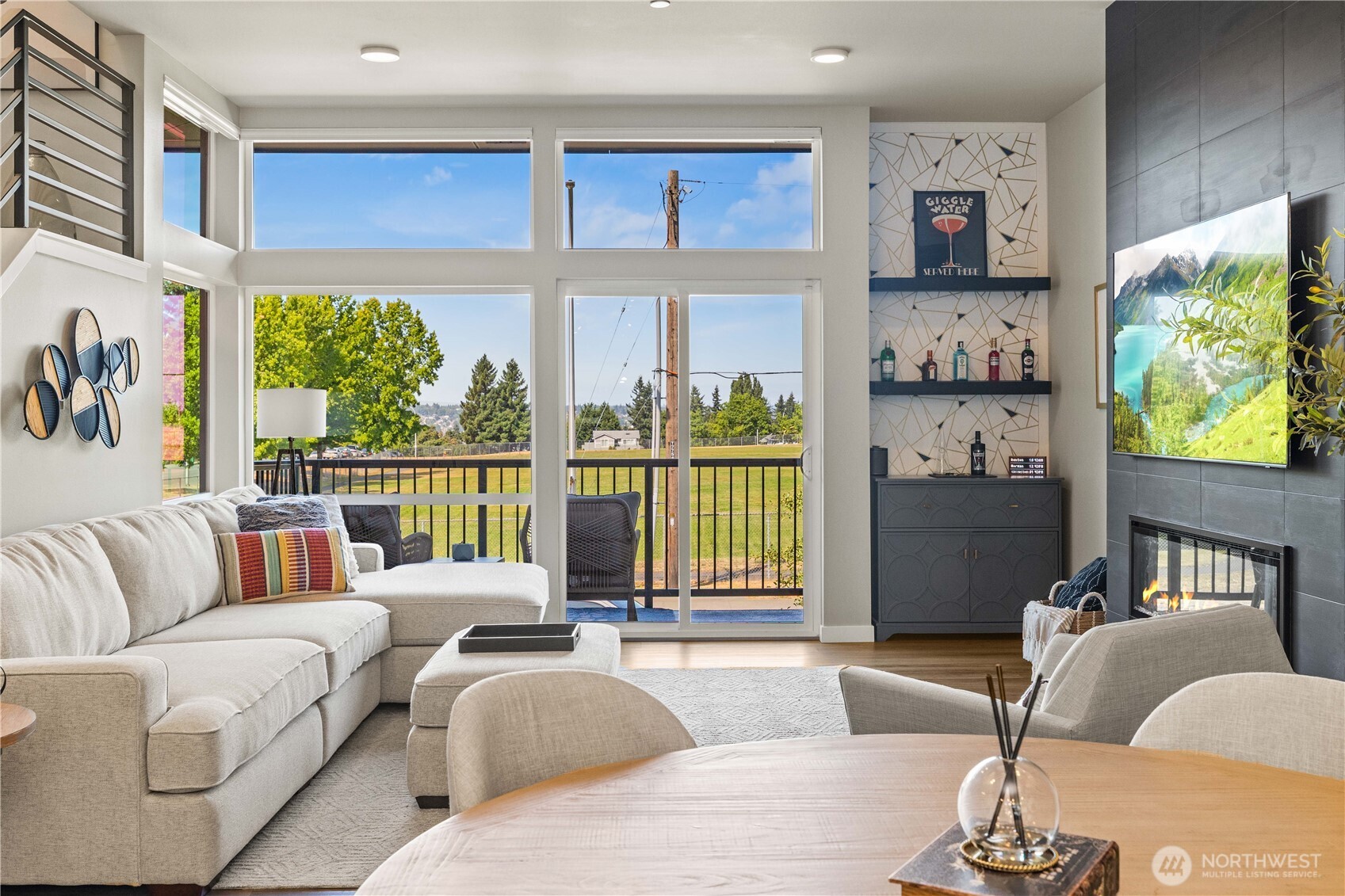 1208 Harrington Avenue Northeast Renton, WA 98056 - Photo 4 of 40 a living room with furniture and a large window