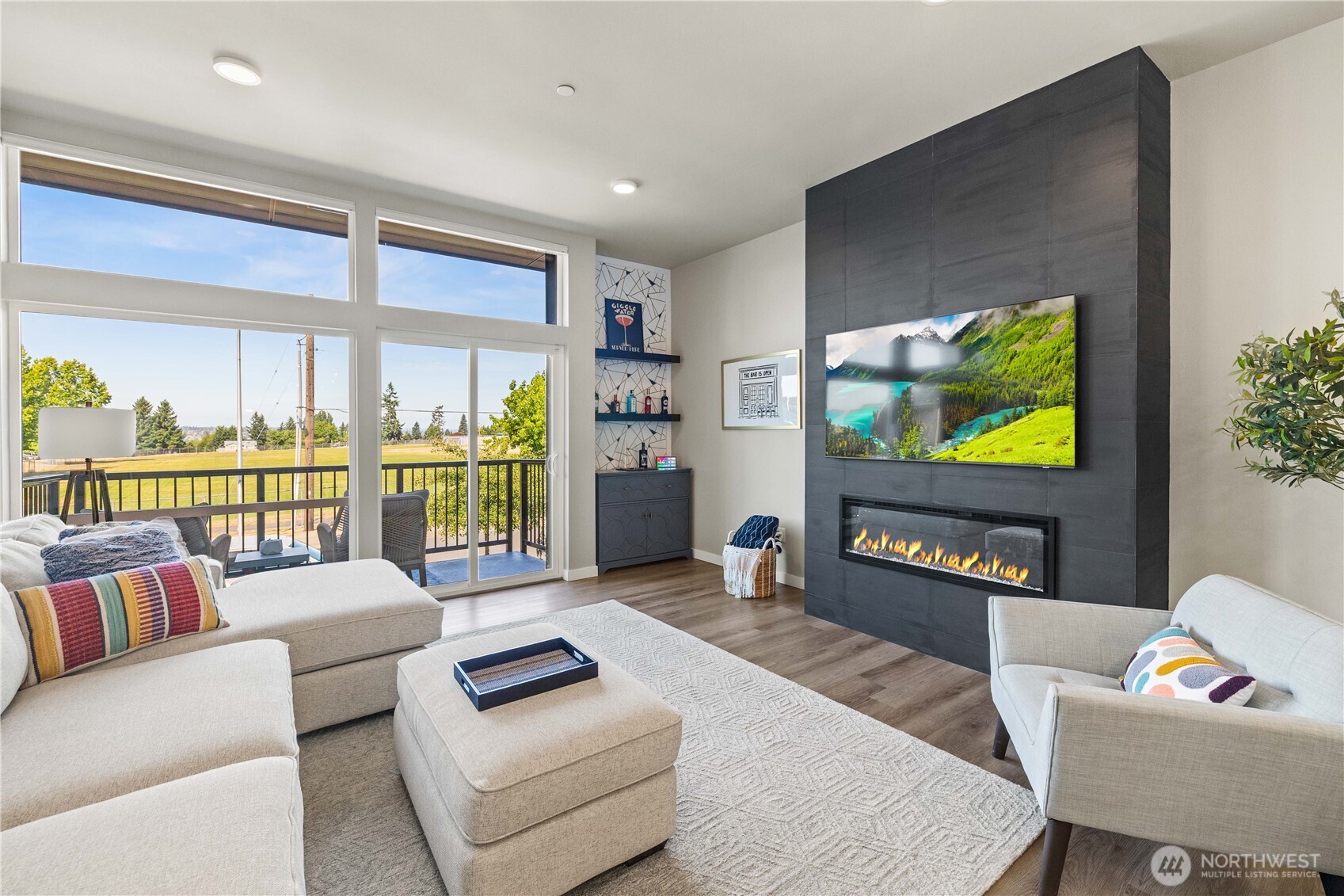 1208 Harrington Avenue Northeast Renton, WA 98056 - Photo 5 of 40 a living room with furniture and a flat screen tv