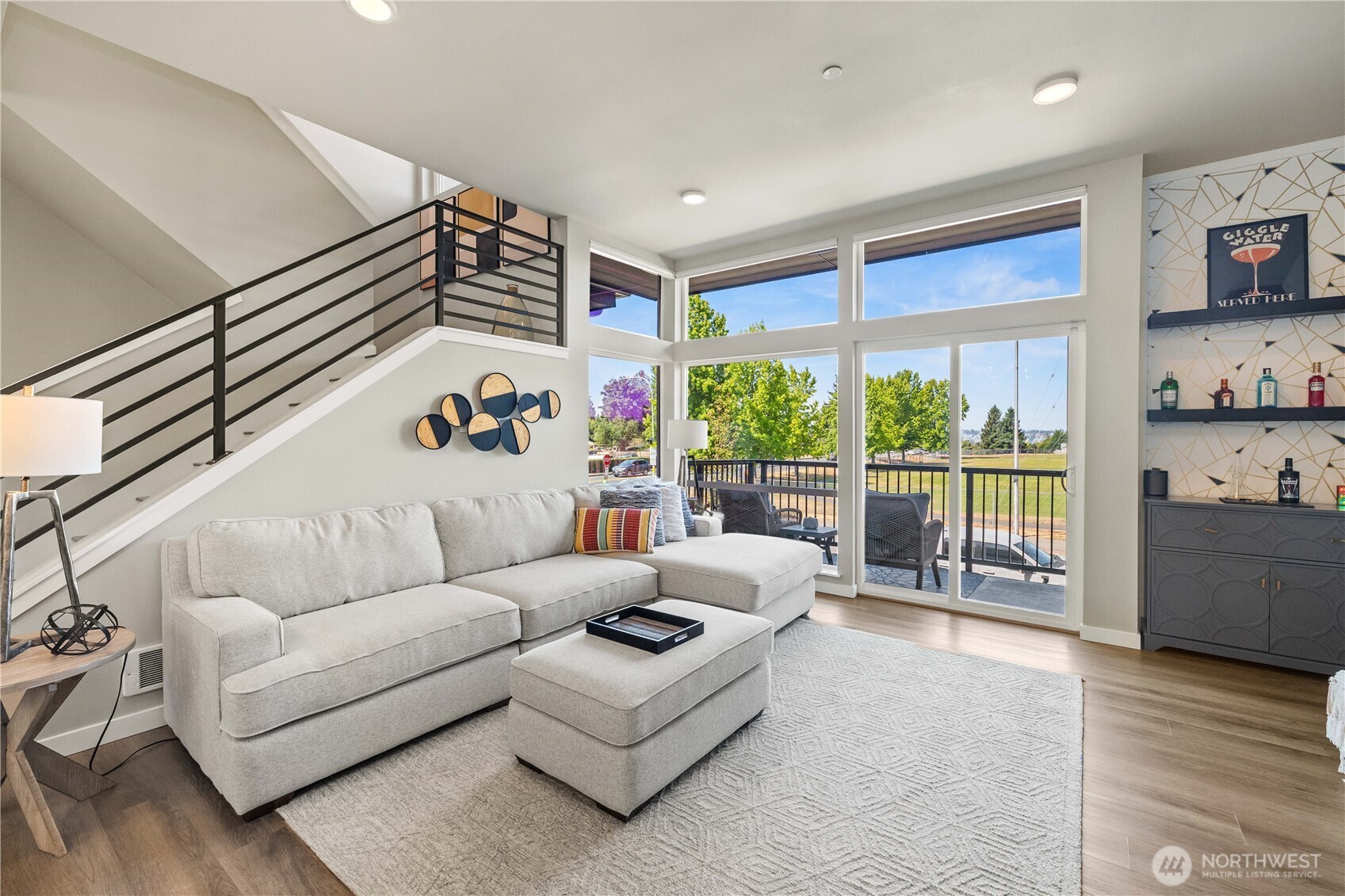 1208 Harrington Avenue Northeast Renton, WA 98056 - Photo 6 of 40 a living room with furniture and a large window