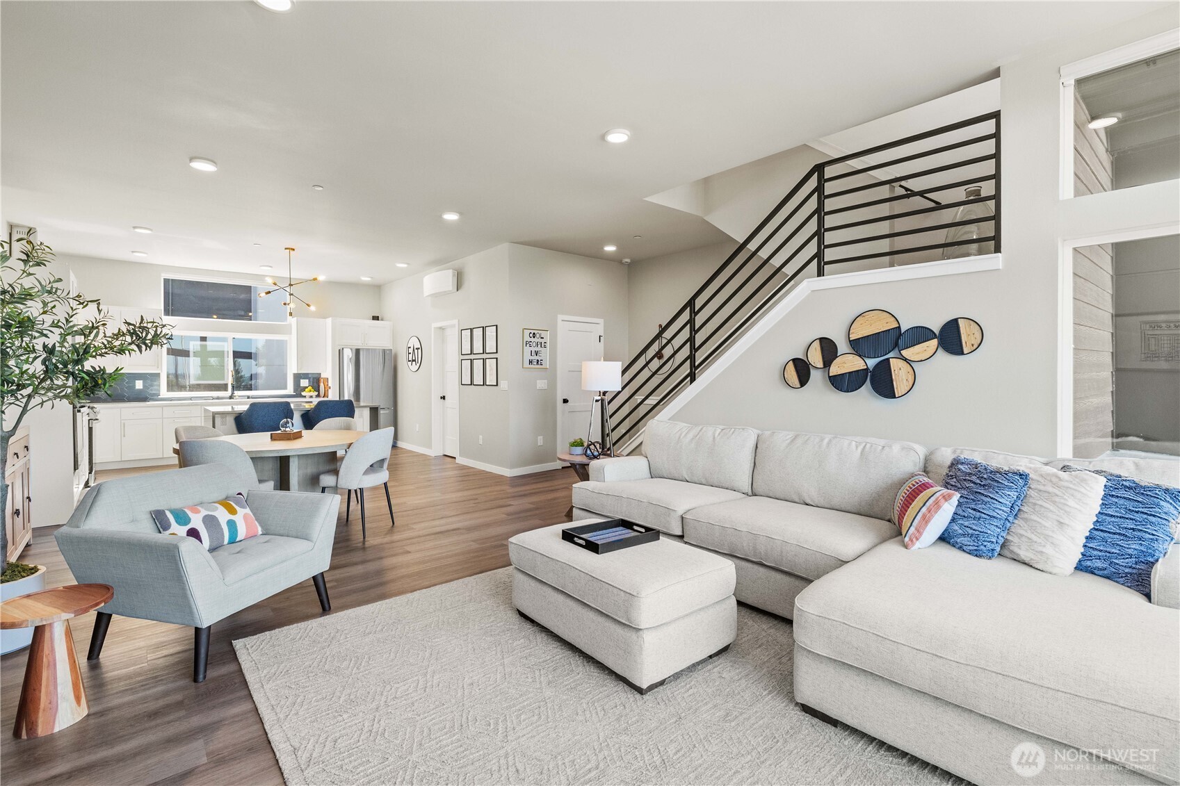 1208 Harrington Avenue Northeast Renton, WA 98056 - Photo 8 of 40 a living room with furniture and wooden floor