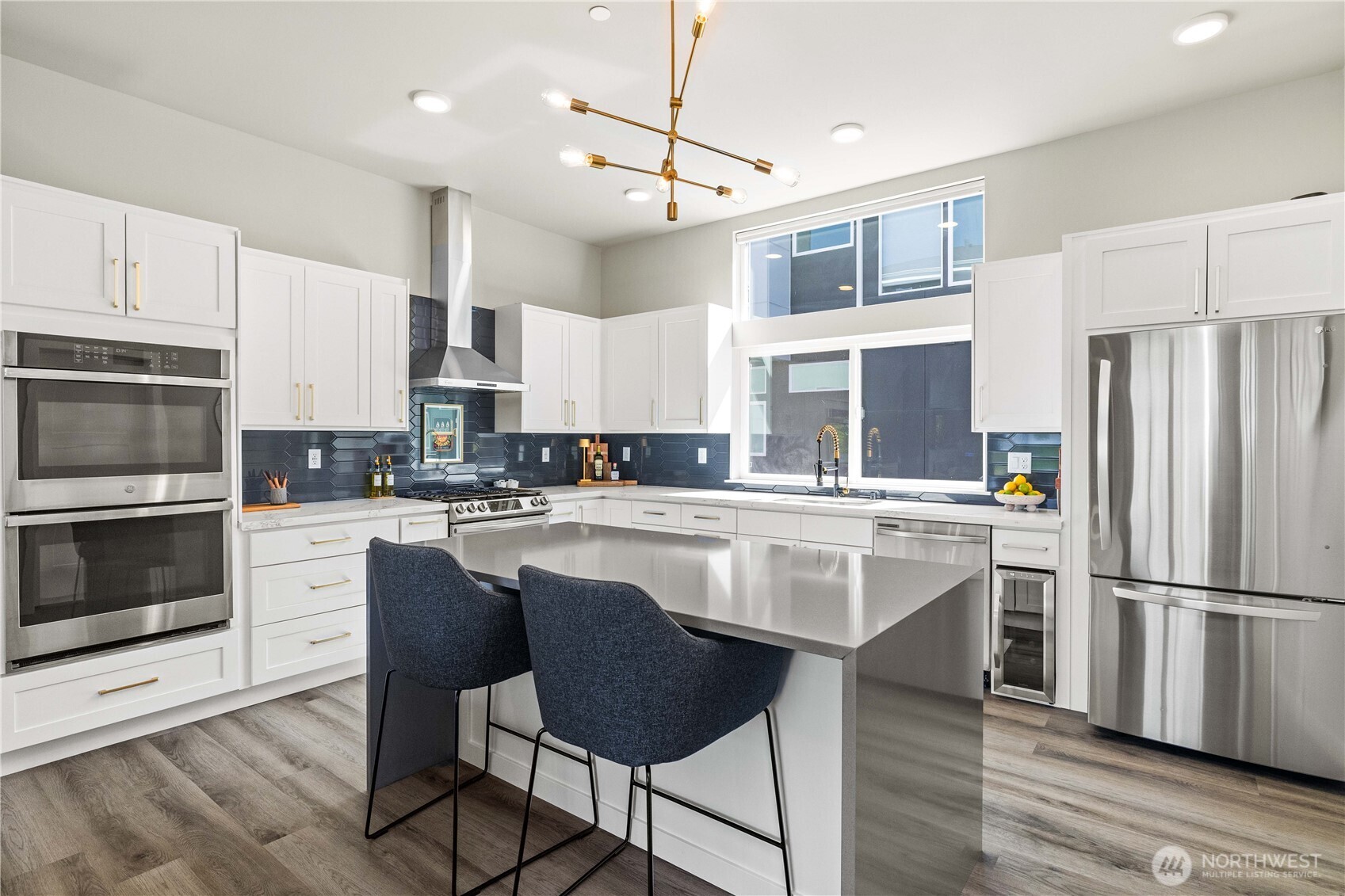 1208 Harrington Avenue Northeast Renton, WA 98056 - Photo 9 of 40 a kitchen with stainless steel appliances granite countertop a stove refrigerator sink and microwave