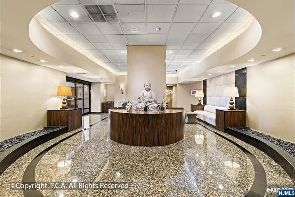 a view of a livingroom with furniture and windows