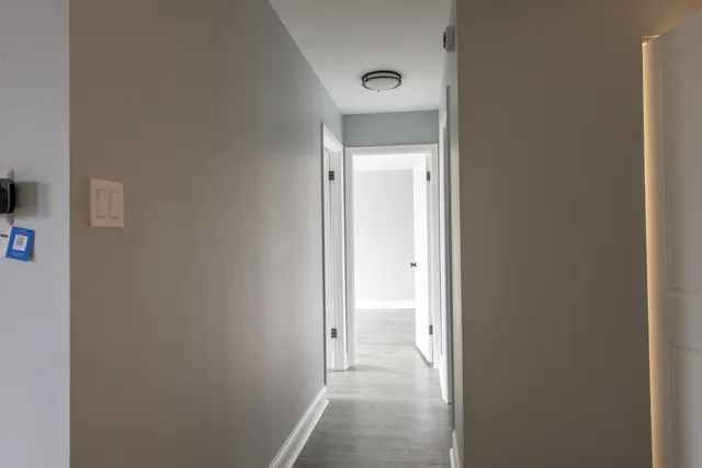 a view of a bathroom from a hallway