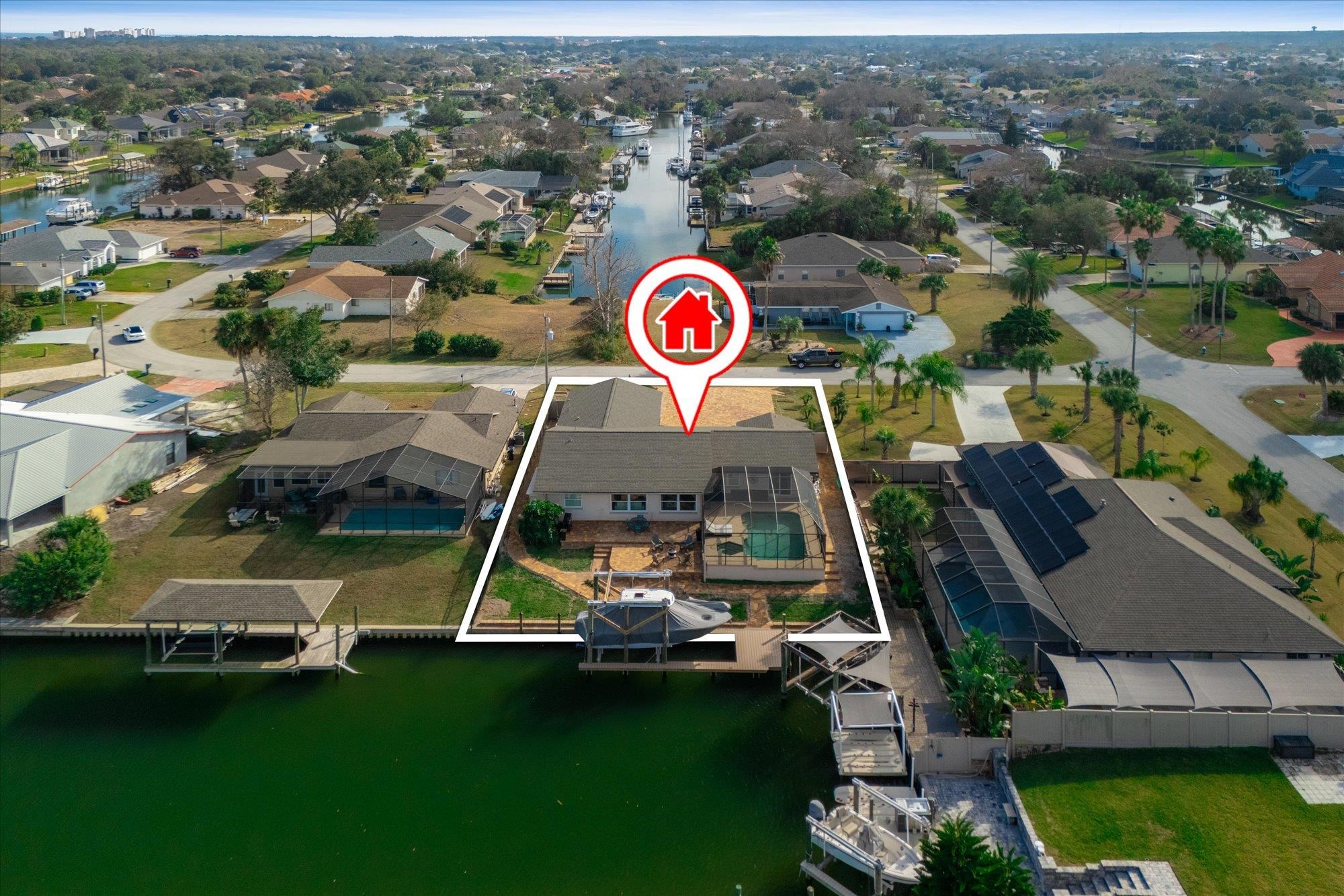 an aerial view of a house with a swimming pool yard and mountain view in back