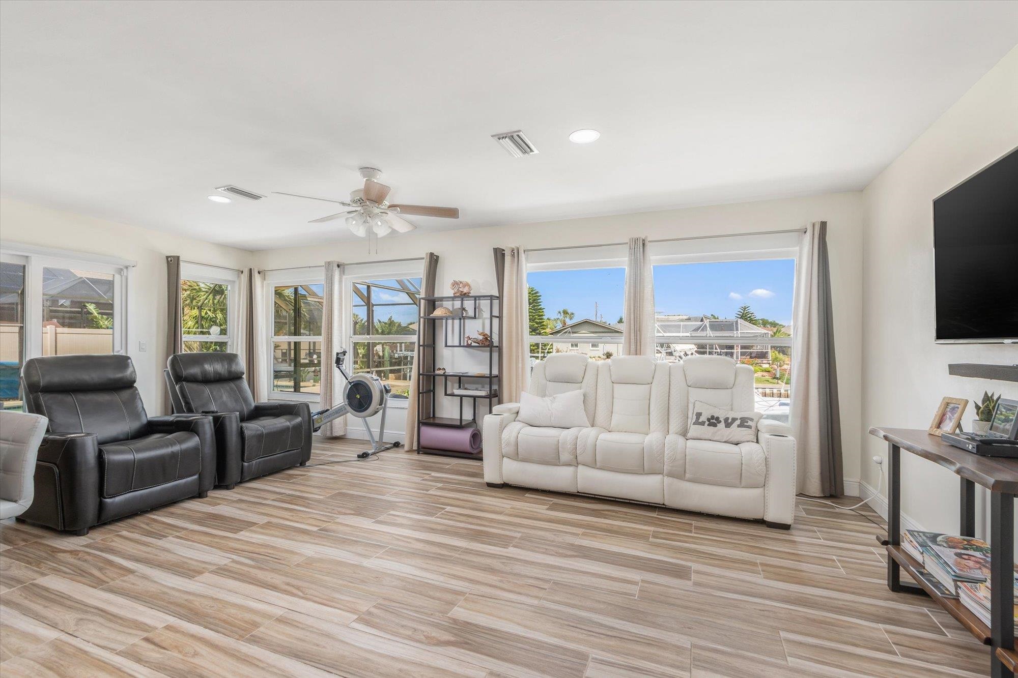5 Cheyenne Court Palm Coast, FL 32137 - Photo 17 of 58 a living room with furniture and a flat screen tv
