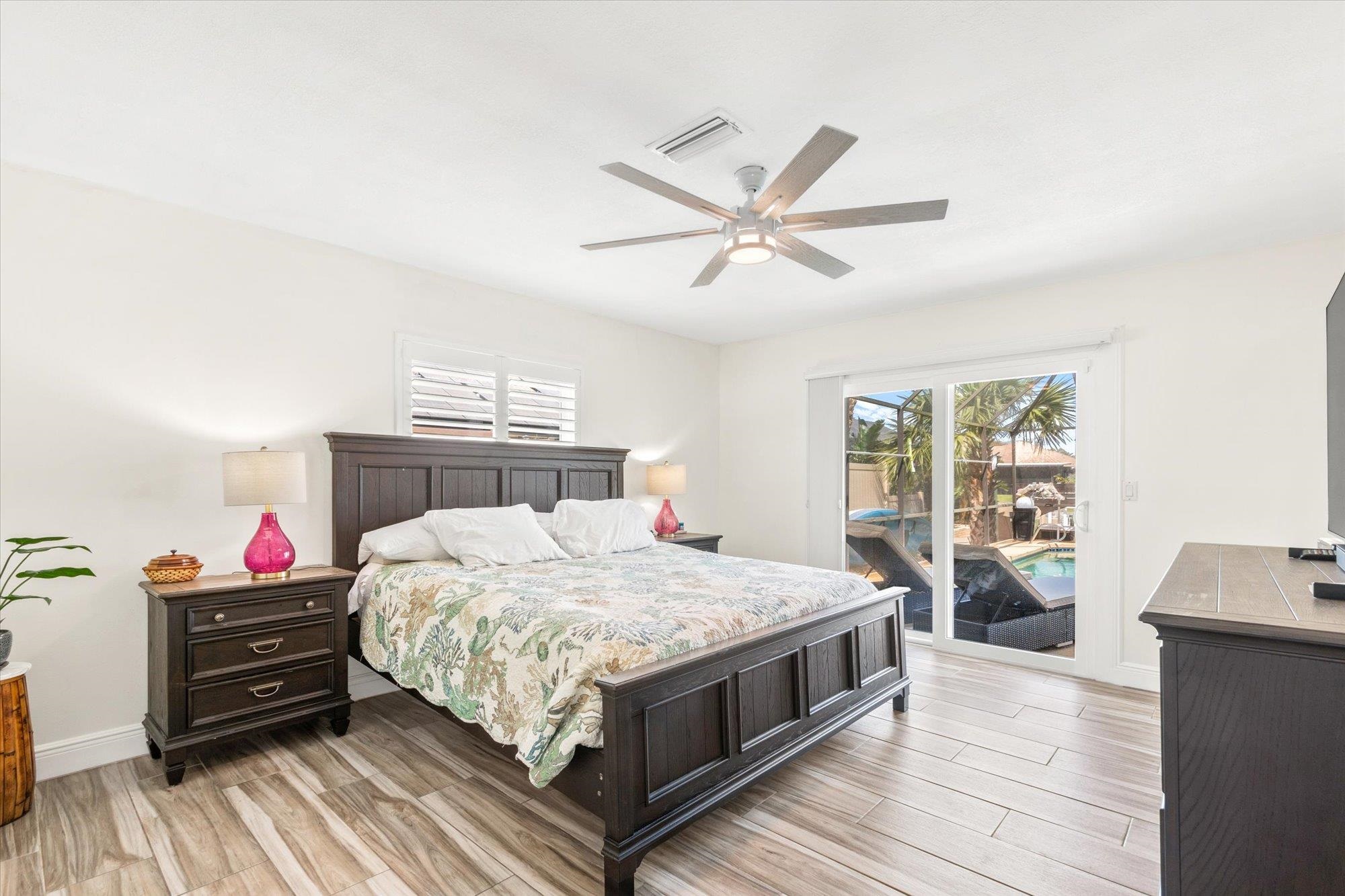 5 Cheyenne Court Palm Coast, FL 32137 - Photo 24 of 58 a bedroom with a bed and wooden floor