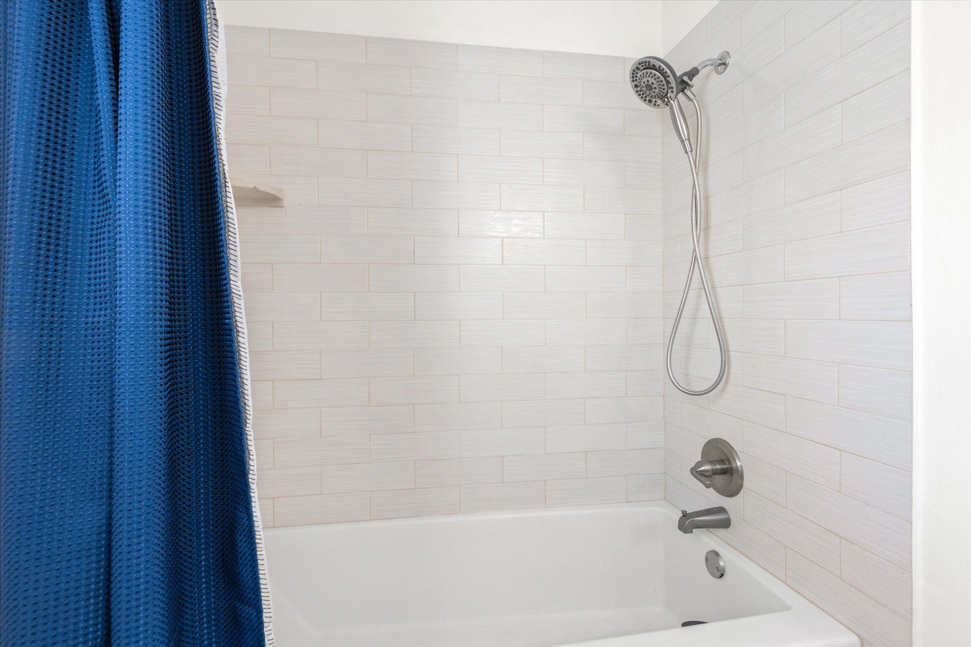 5 Cheyenne Court Palm Coast, FL 32137 - Photo 31 of 58 a bathroom with a bath tub with a shower