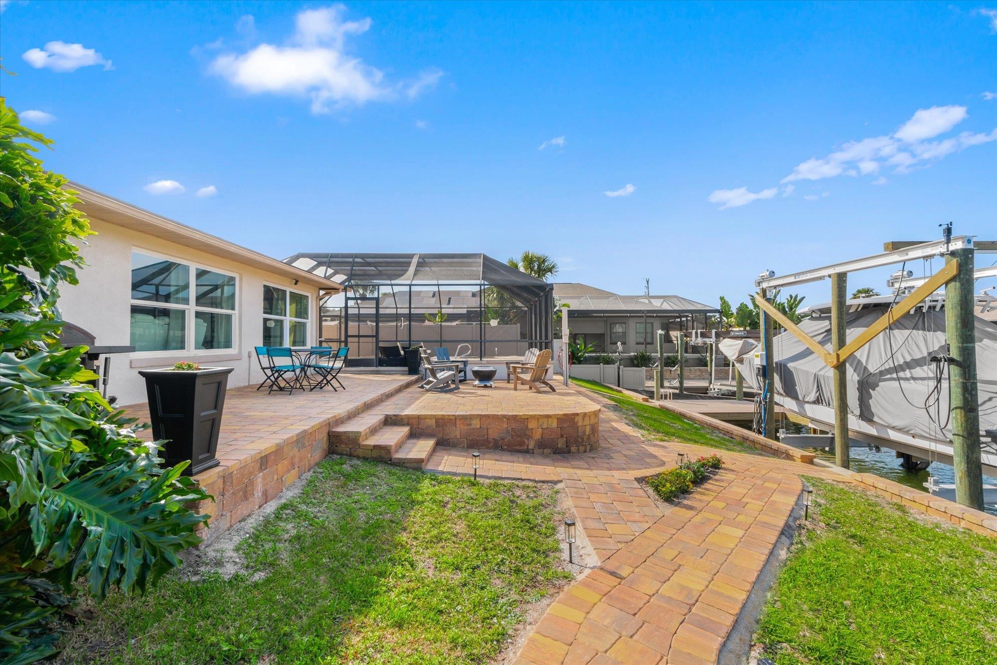 5 Cheyenne Court Palm Coast, FL 32137 - Photo 32 of 58 a view of a backyard with swimming pool