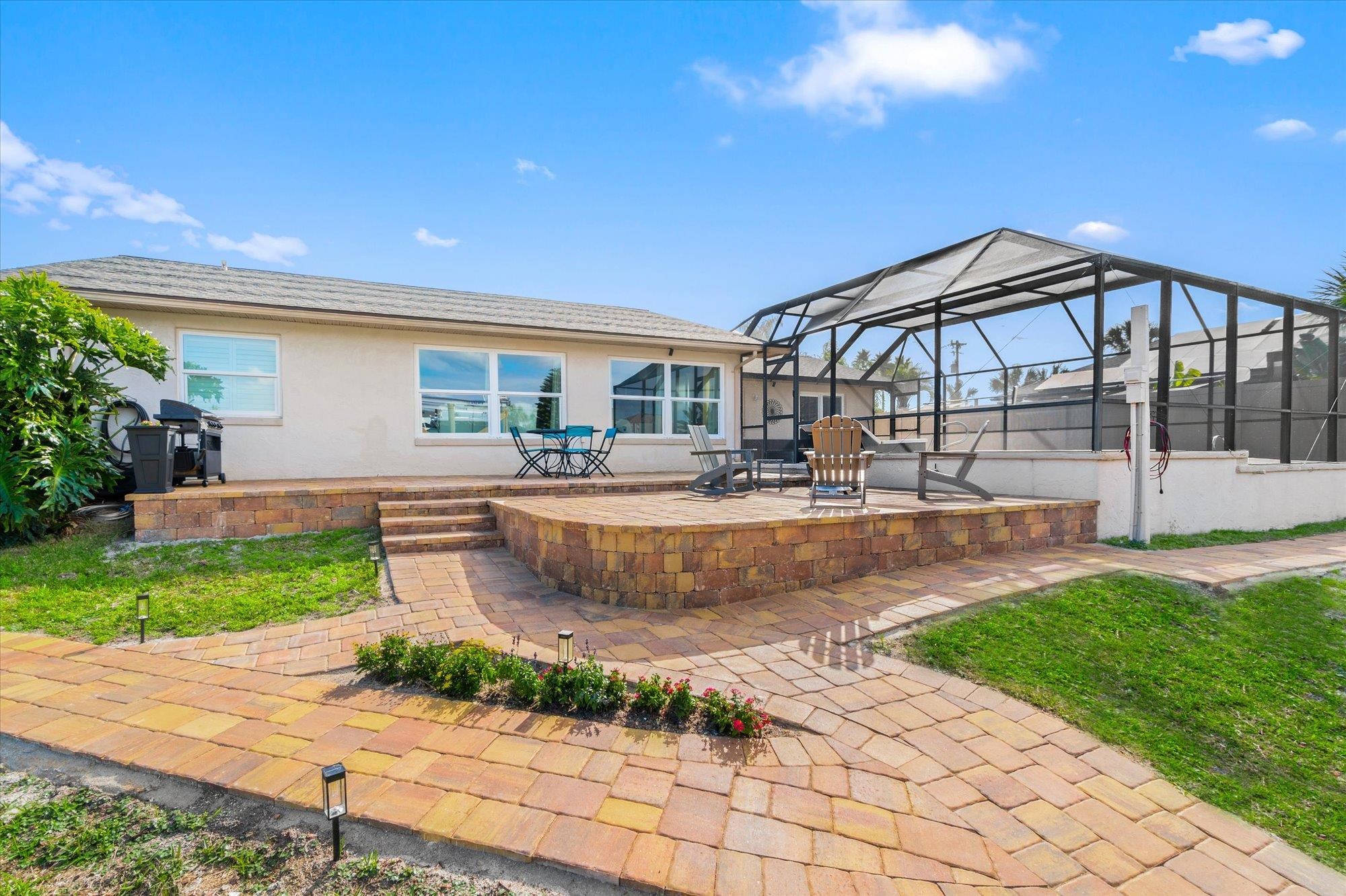 5 Cheyenne Court Palm Coast, FL 32137 - Photo 34 of 58 a front view of a house with garden
