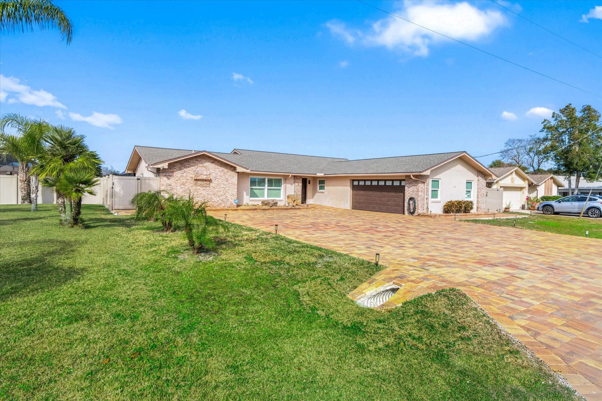 5 Cheyenne Court Palm Coast, FL 32137 - Photo 5 of 58 a view of house with backyard and a tree