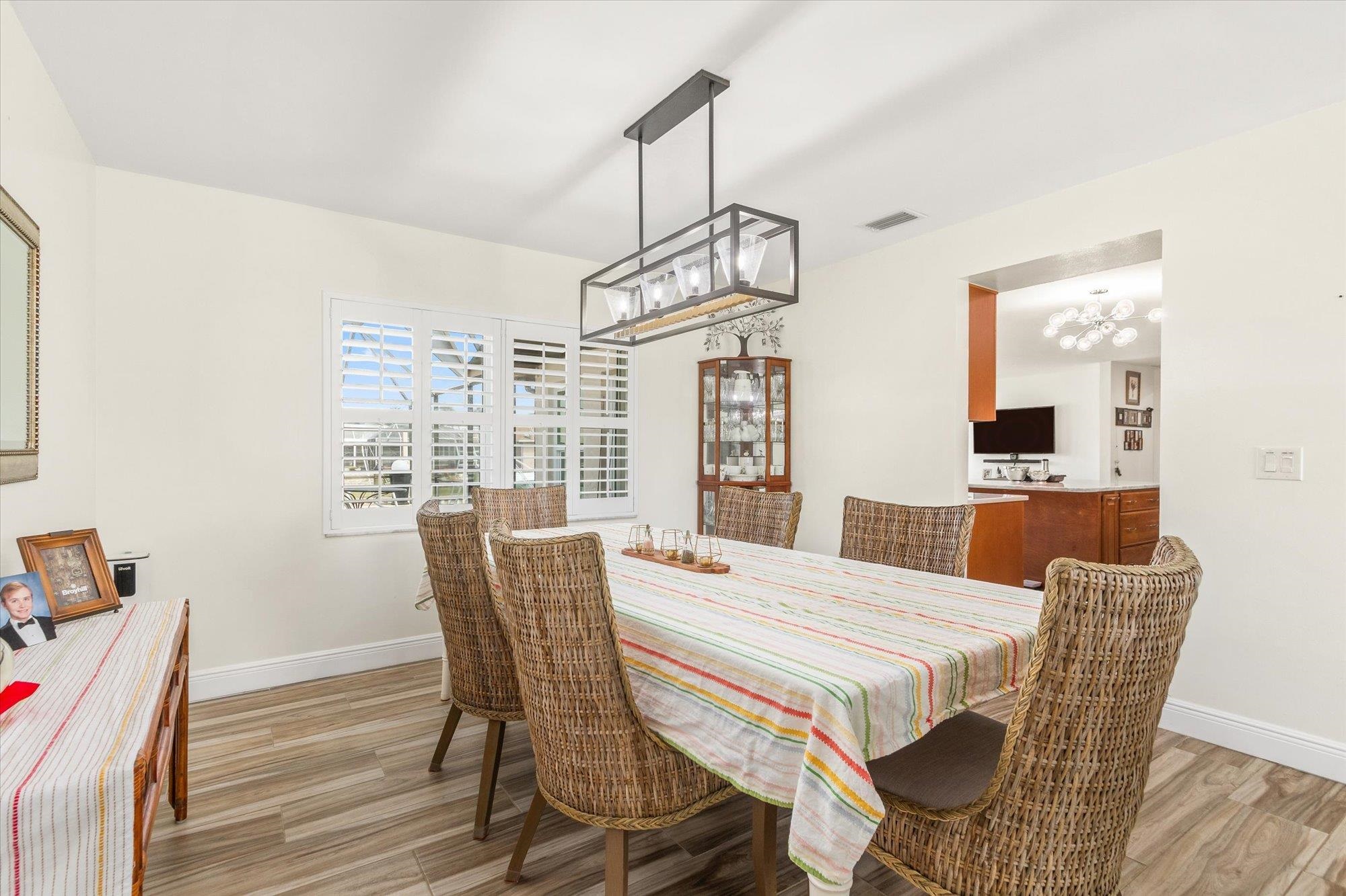 5 Cheyenne Court Palm Coast, FL 32137 - Photo 10 of 58 a view of a dining room with furniture window and wooden floor