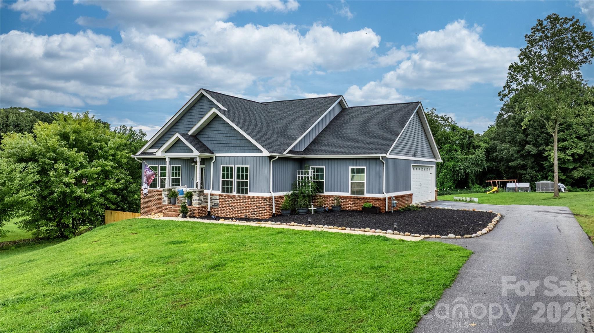 111 Pinewood Road Granite Falls, NC 28630 - Photo 3 of 33 a view of house with garden