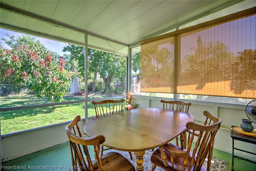 310 Pine Tree Lane Sebring, FL 33872 - Photo 24 of 28 a view of a dining room with furniture window and outside view