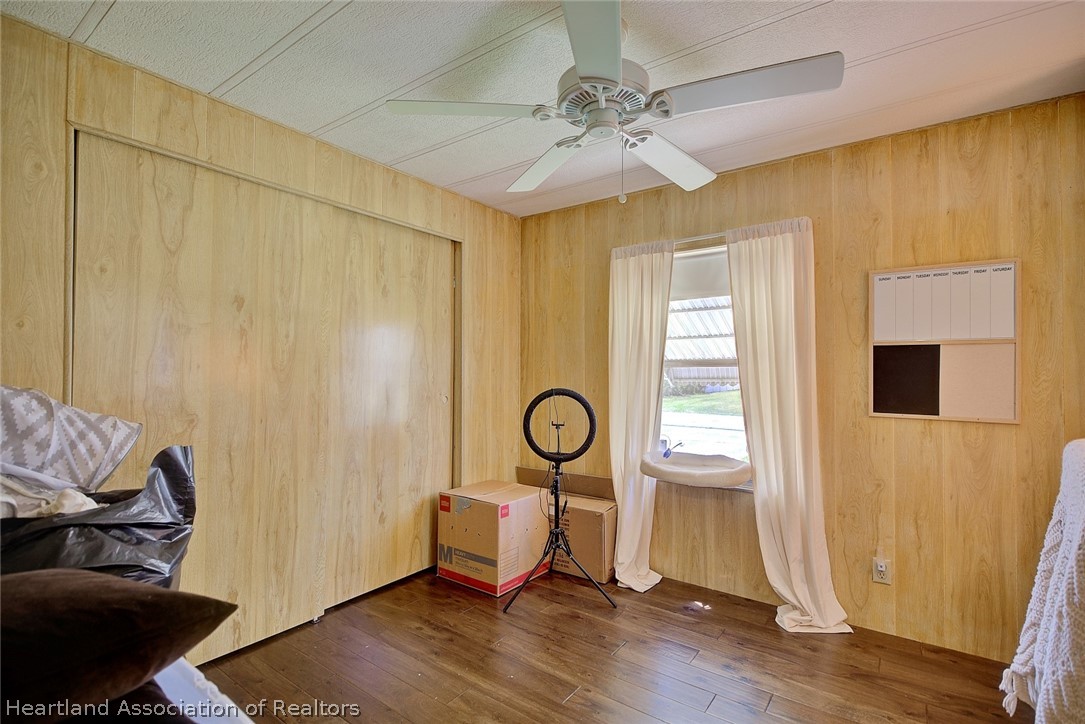 310 Pine Tree Lane Sebring, FL 33872 - Photo 7 of 28 a living room with furniture and a window