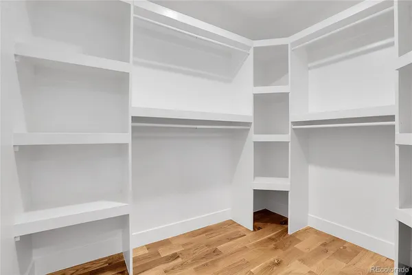 a view of an empty room with a closet