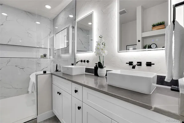 a white kitchen with cabinets and window