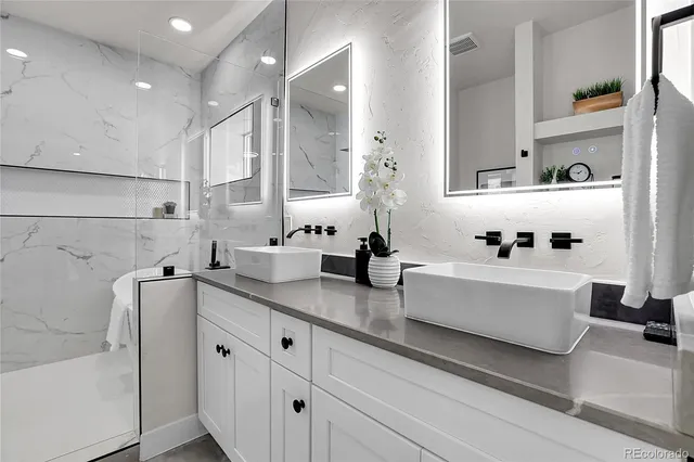 a white kitchen with cabinets and window