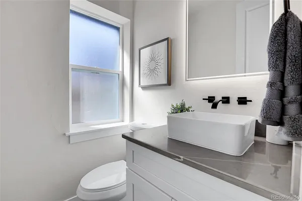 a white bath tub sitting next to a white toilet