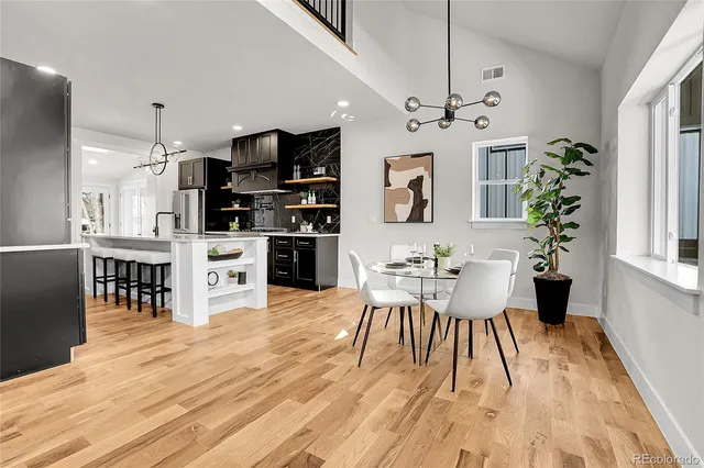 a view of a dining room with furniture window and wooden floor