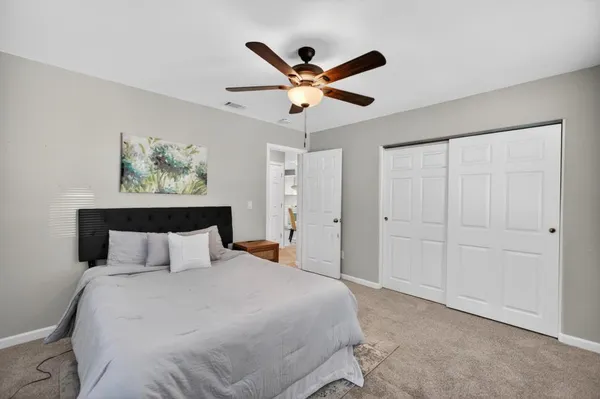 a bathroom with a bathtub shower sink vanity and toilet