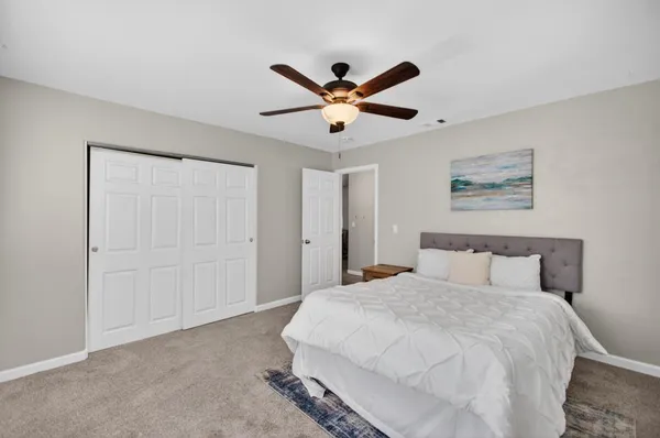 a living room with furniture and a piano