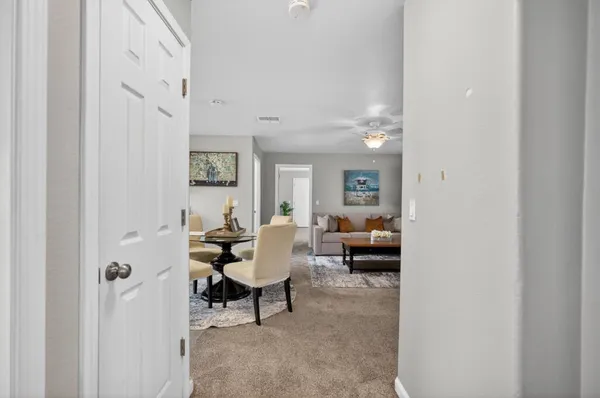 a bedroom with a bed and a ceiling fan