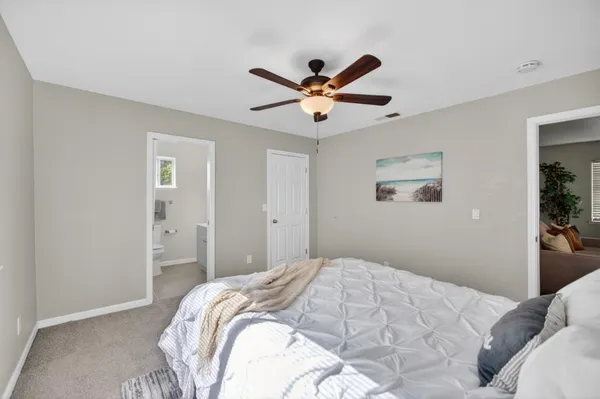 a en suite bathroom with a sink double vanity and a mirror