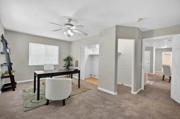 a workspace with furniture and window in a room