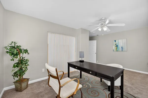 a view of an house with backyard and garden