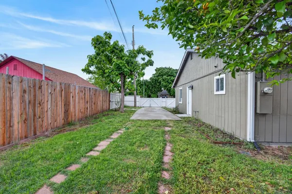 a backyard of a house with lots of green space