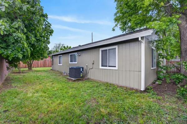 a view of a back yard of the house