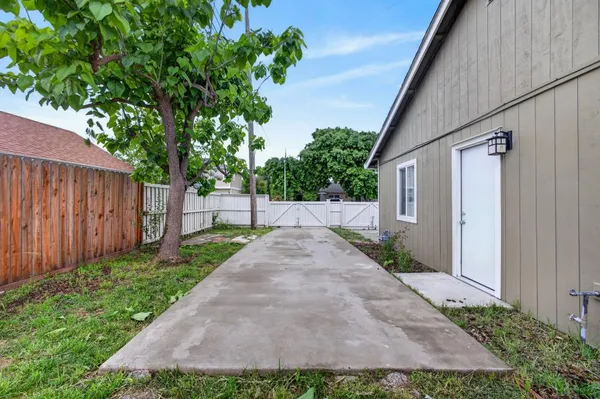 a view of an house with backyard space and garden