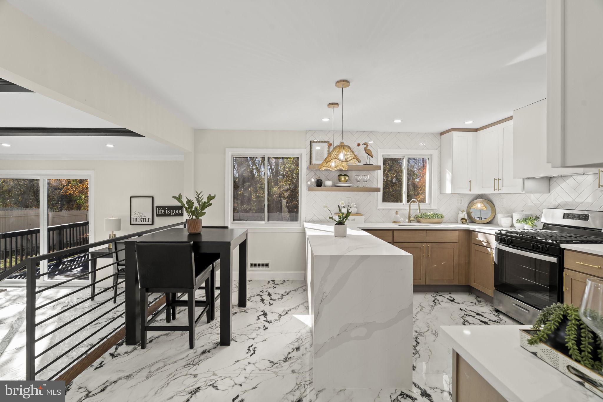 33 Millbridge Road Clementon, NJ 08021 - Photo 11 of 34 a kitchen with a table chairs sink and cabinets