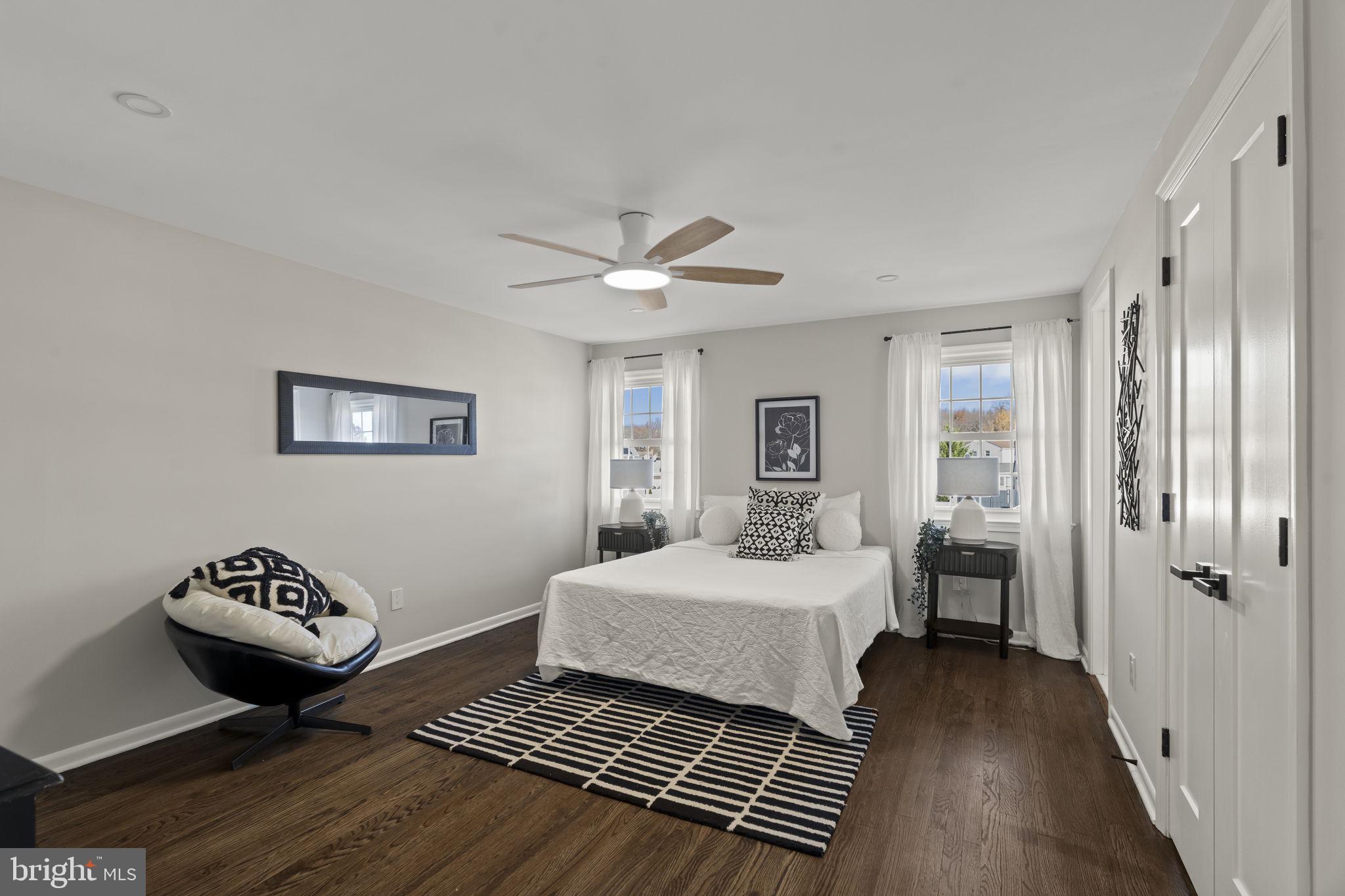 33 Millbridge Road Clementon, NJ 08021 - Photo 18 of 34 a bedroom with a bed and a table with wooden floor