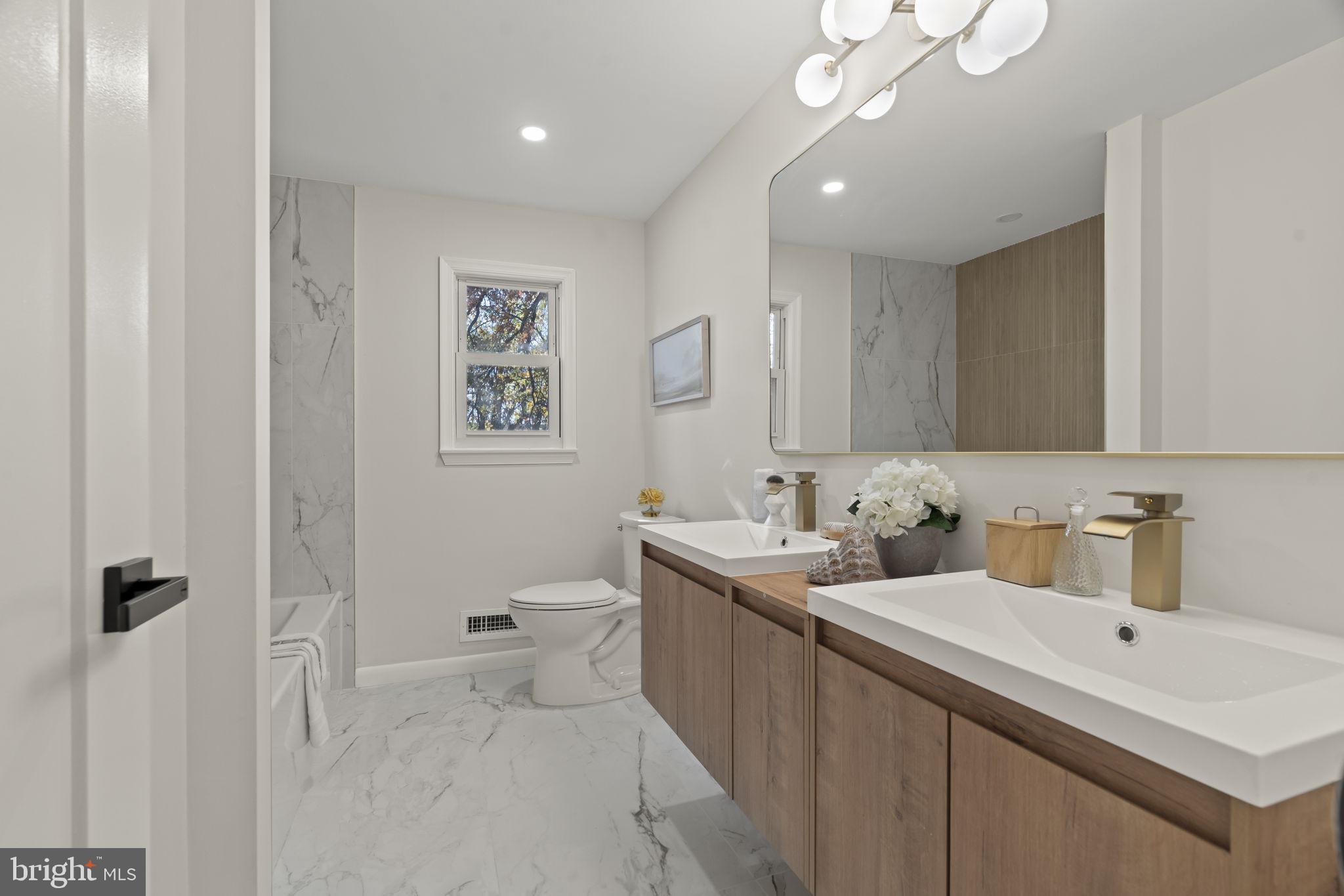 33 Millbridge Road Clementon, NJ 08021 - Photo 23 of 34 a bathroom with a toilet sink and mirror