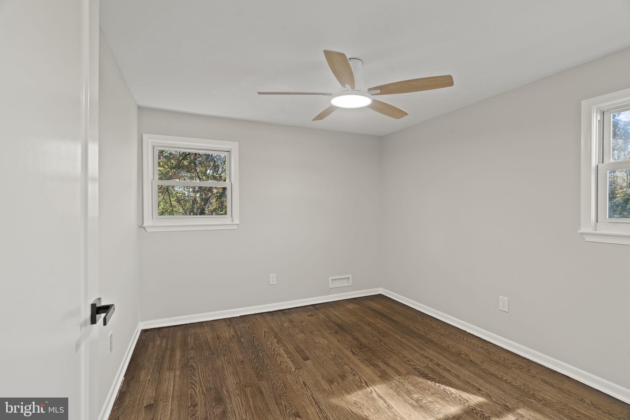 33 Millbridge Road Clementon, NJ 08021 - Photo 25 of 34 wooden floor in an empty room with a window