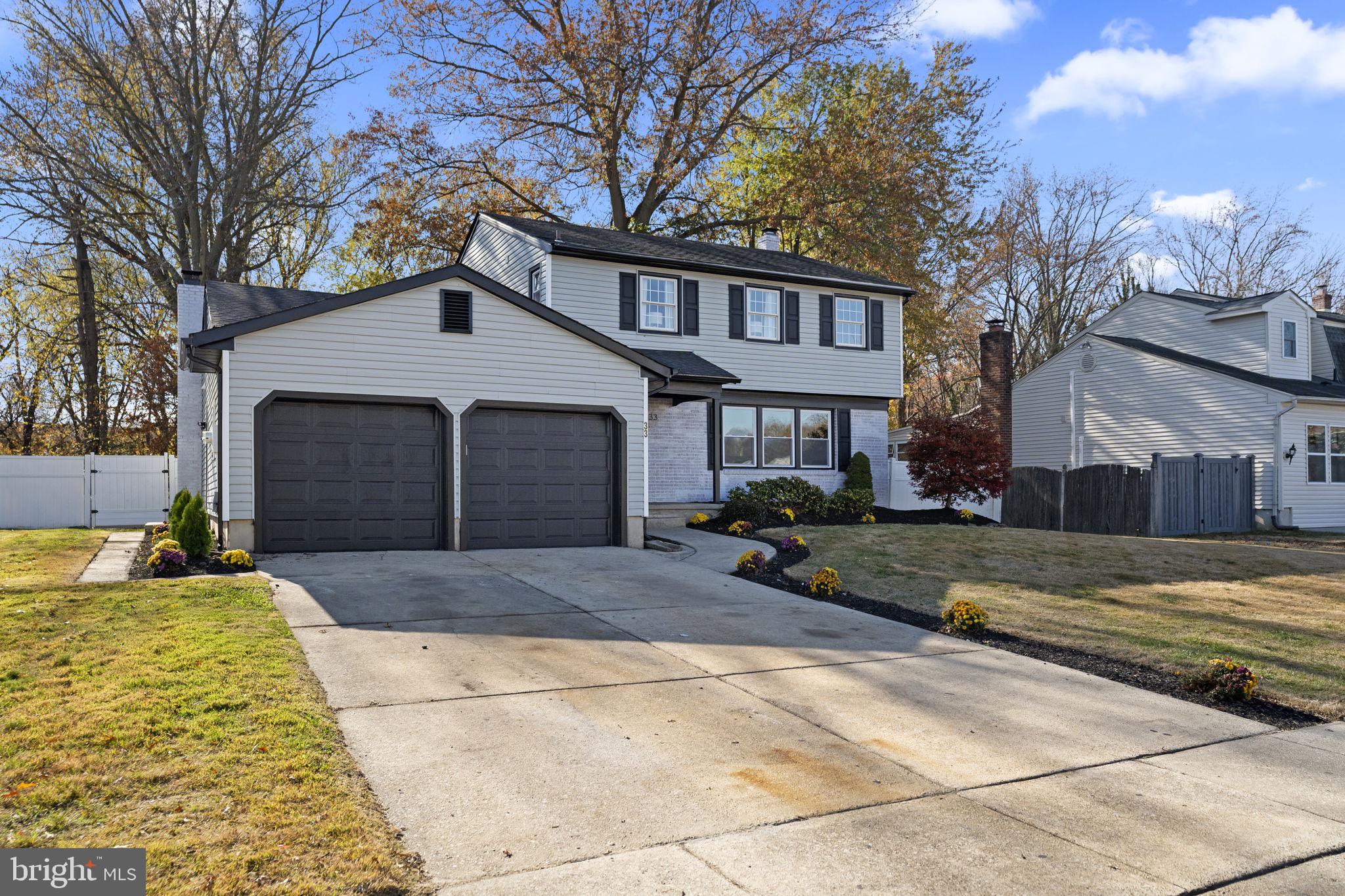 33 Millbridge Road Clementon, NJ 08021 - Photo 34 of 34 a front view of a house with a yard and garage