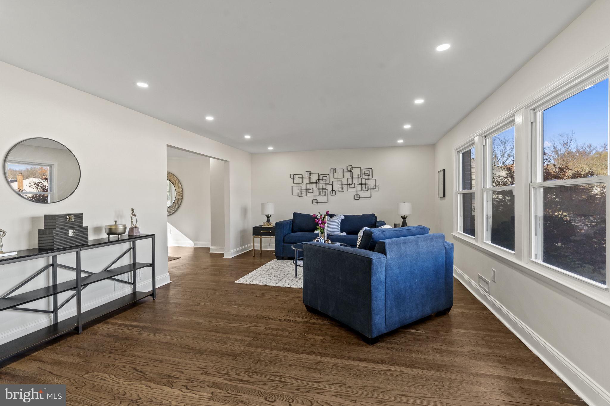 33 Millbridge Road Clementon, NJ 08021 - Photo 5 of 34 a living room with furniture and a large mirror