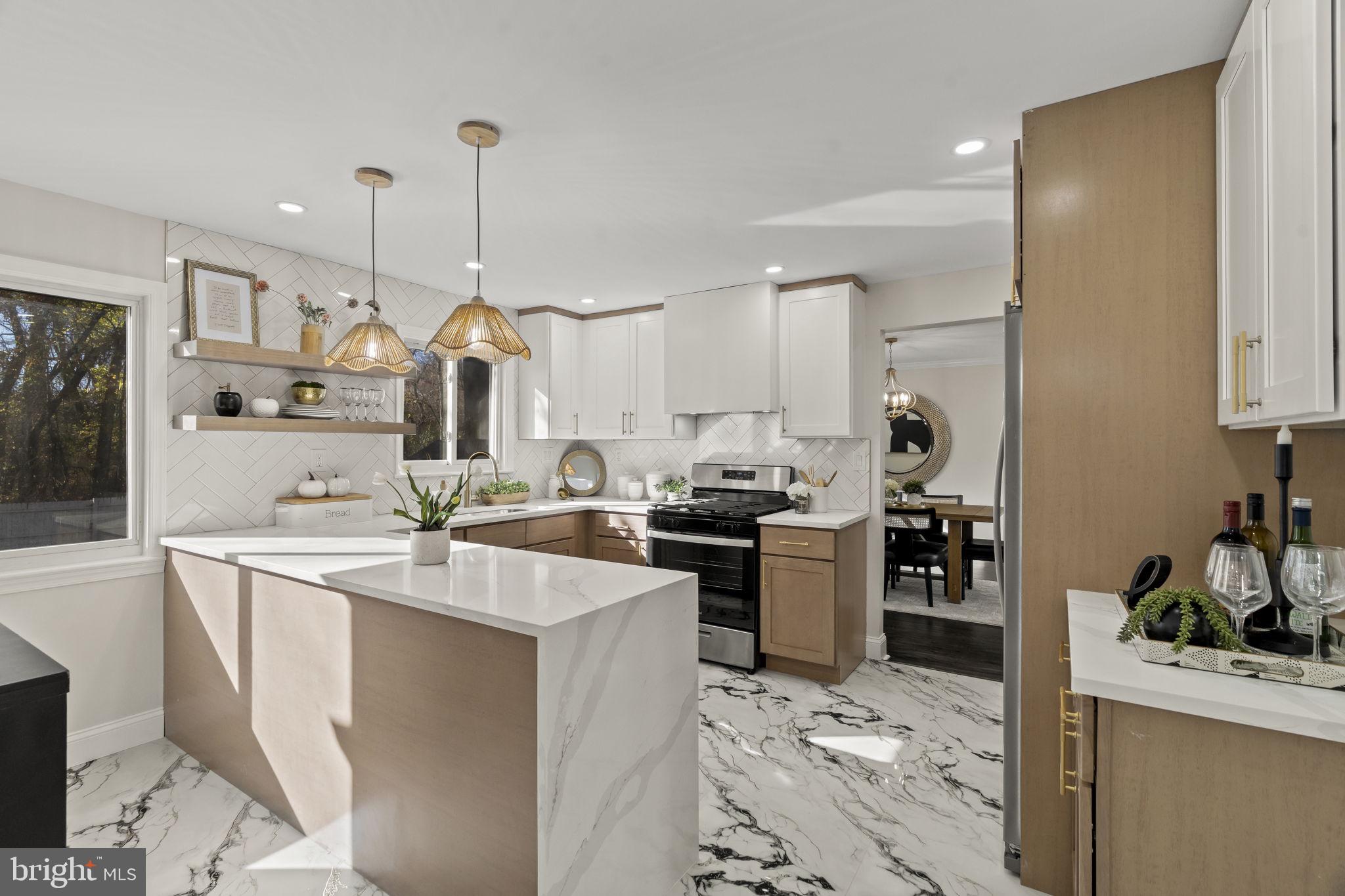 33 Millbridge Road Clementon, NJ 08021 - Photo 7 of 34 a kitchen with sink refrigerator and cabinets