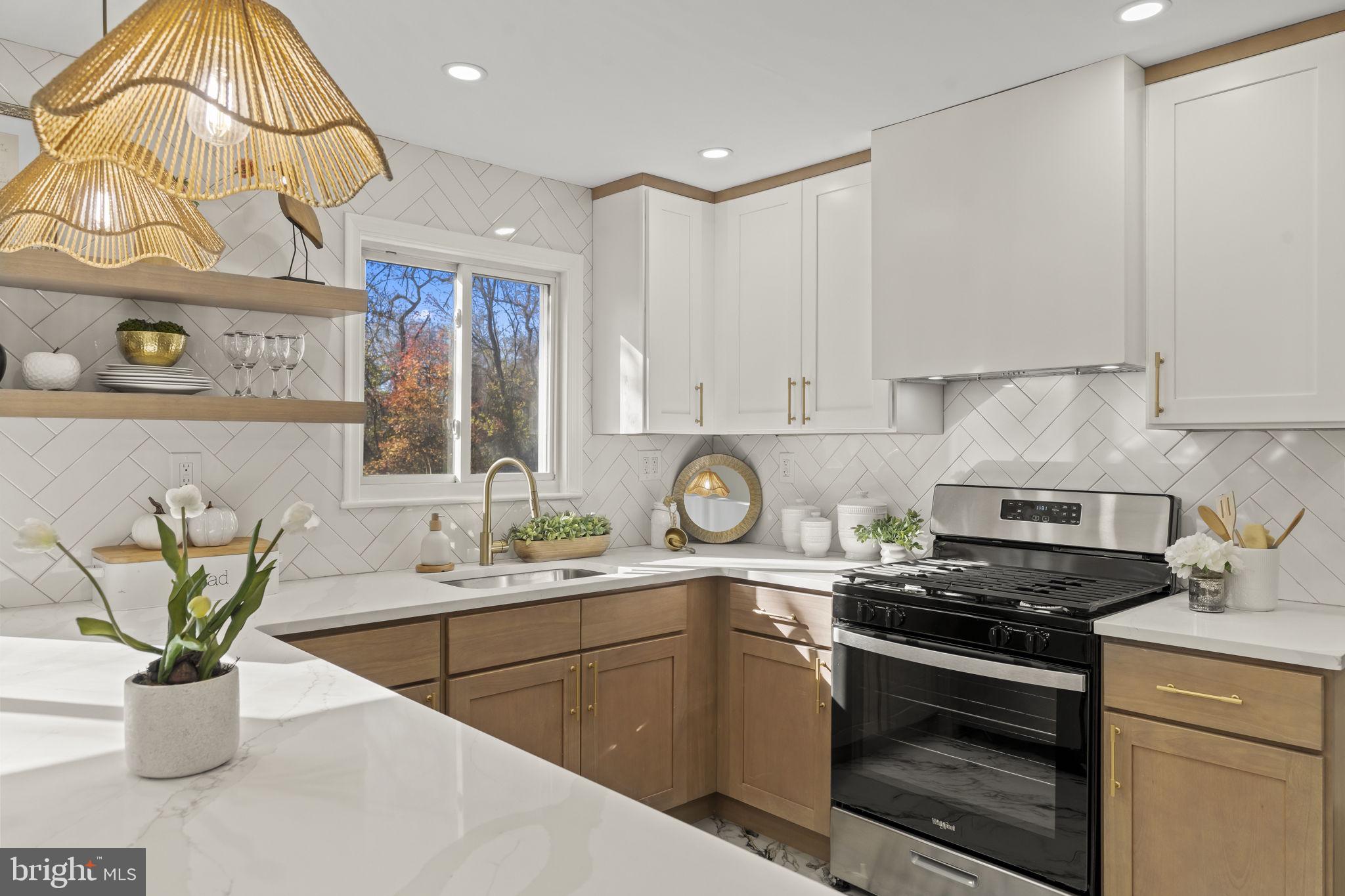 33 Millbridge Road Clementon, NJ 08021 - Photo 8 of 34 a kitchen with a sink a stove and cabinets