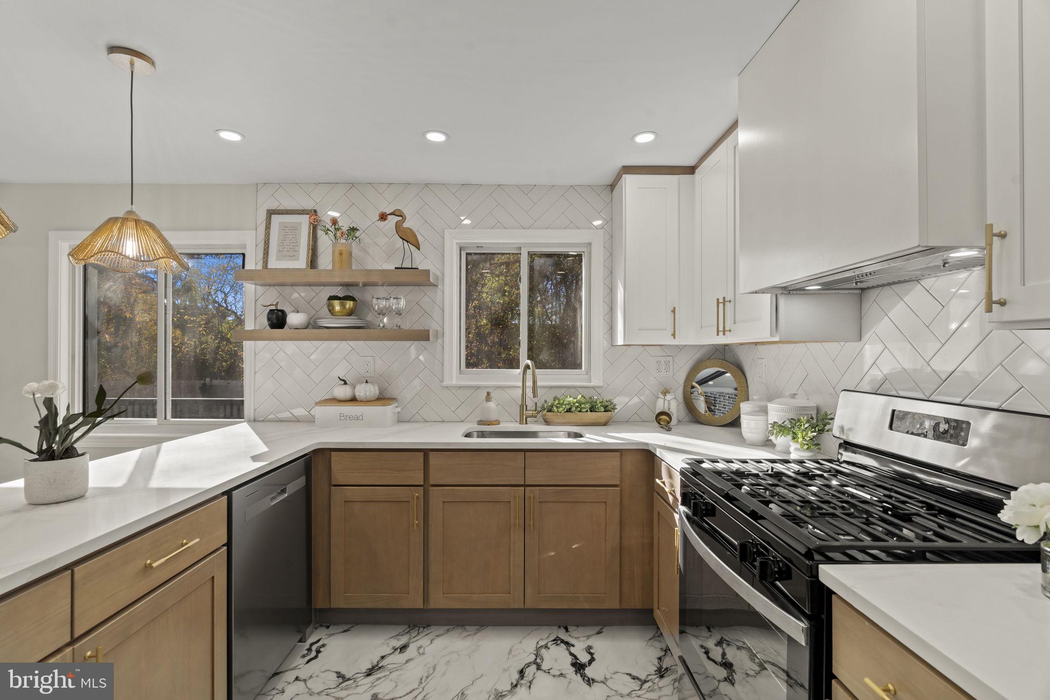 33 Millbridge Road Clementon, NJ 08021 - Photo 9 of 34 a kitchen with a sink stove and cabinets