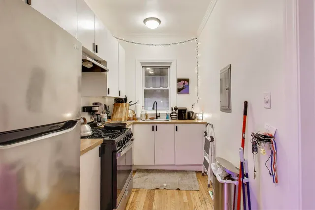 a view of a kitchen with appliances and a window