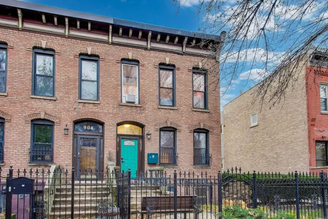 a front view of a house with glass windows