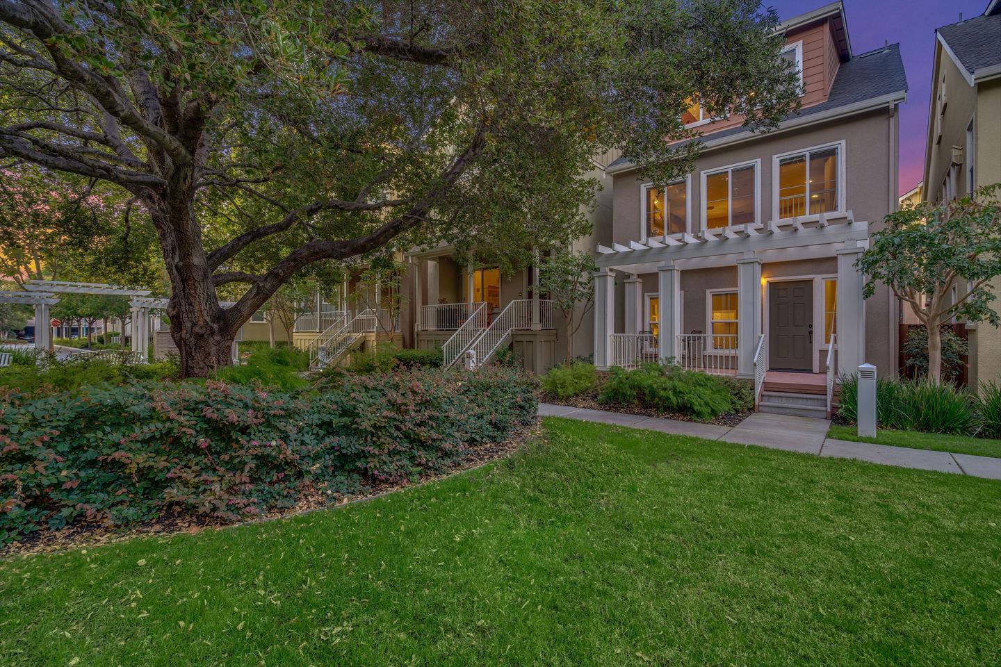 a front view of a house with a garden